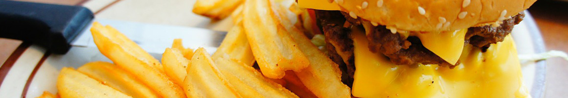Eating Burger at Wibbley's Burgers restaurant in Bellevue, WA.